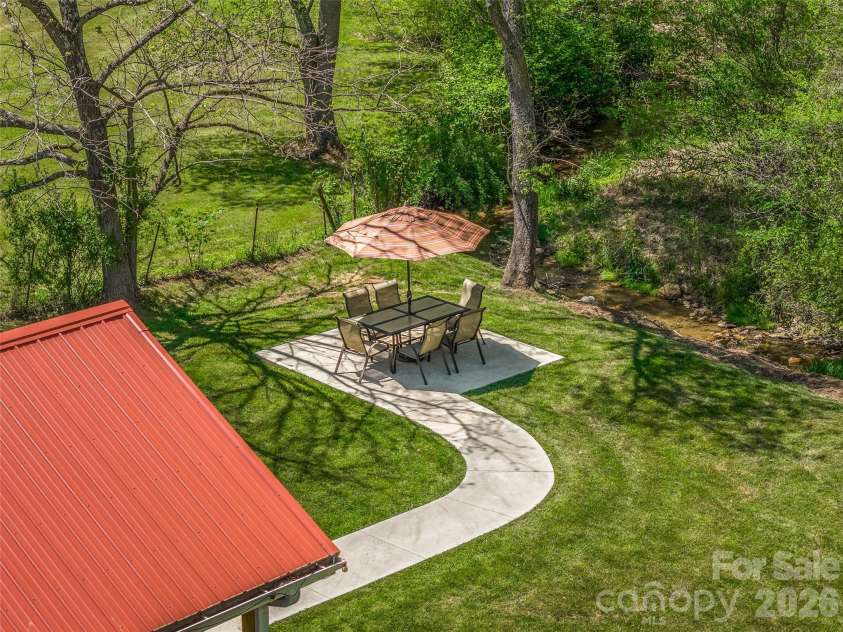5881 US 23 Highway, Mars Hill, NC 28754.  MLS# CAR4374196, YatesRealty ID 18088. Creekside patio