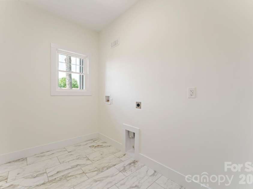 11932 Crabapple Lane, Huntersville, NC 28078.  MLS# CAR4373724, YatesRealty ID 18090. Main level laundry room