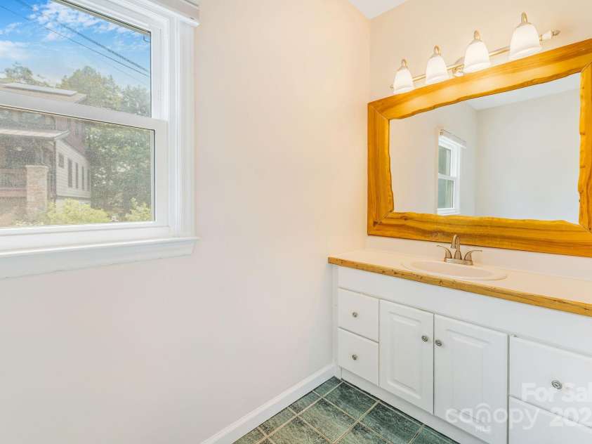 64 McLain Street, Asheville, NC 28803.  MLS# CAR4264708, YatesRealty ID 18090. Main level full bathroom
