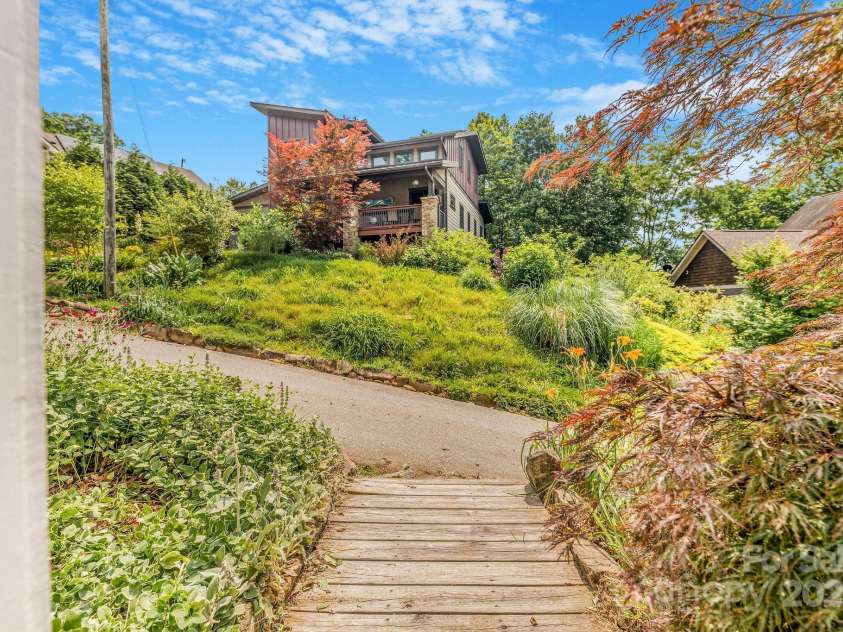 64 McLain Street, Asheville, NC 28803.  MLS# CAR4264708, YatesRealty ID 18090. Side entrance walkway