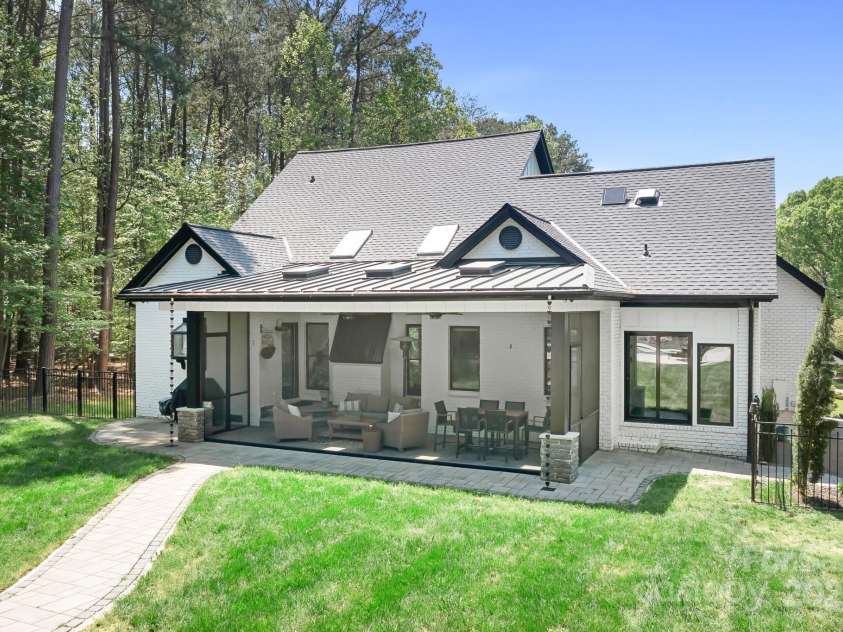 317 Marietta Road, Mooresville, NC 28117.  MLS# CAR4253368, YatesRealty ID 18093. Back of home featuring new roof, new screened patio, skylights, new windows, new paint.