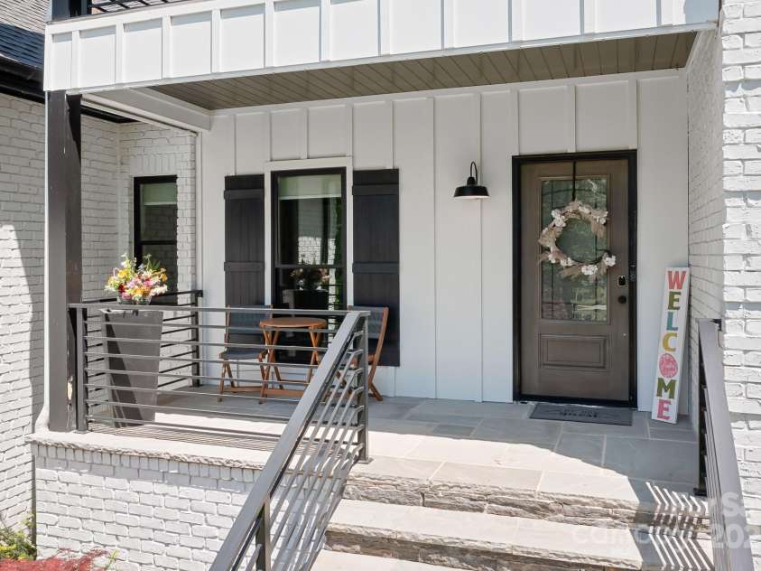317 Marietta Road, Mooresville, NC 28117.  MLS# CAR4253368, YatesRealty ID 18093. Drink in the lovely Lake View from the front porch, accentuated by the trees that ensconce this charming home providing wonderful privacy.
