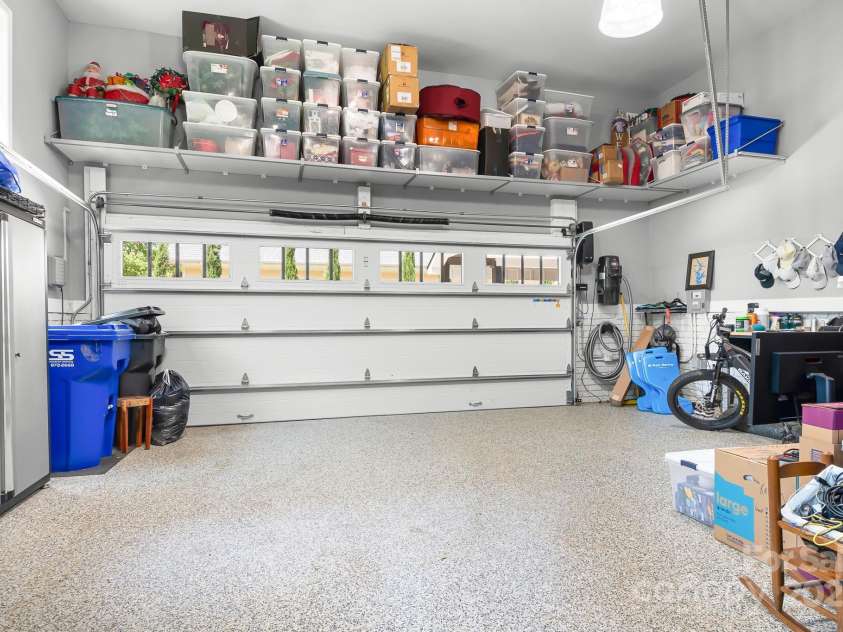 317 Marietta Road, Mooresville, NC 28117.  MLS# CAR4253368, YatesRealty ID 18093. Epoxy floor and above head storage system in garage.