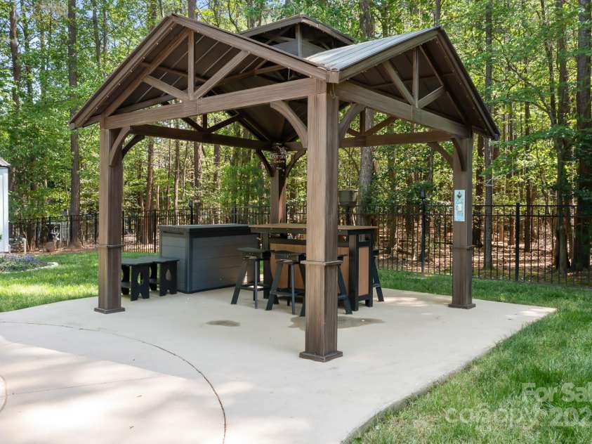 317 Marietta Road, Mooresville, NC 28117.  MLS# CAR4253368, YatesRealty ID 18093. Gazebo providing some nice shade.  Could be another seating area or a bar area as the sellers have used it for.