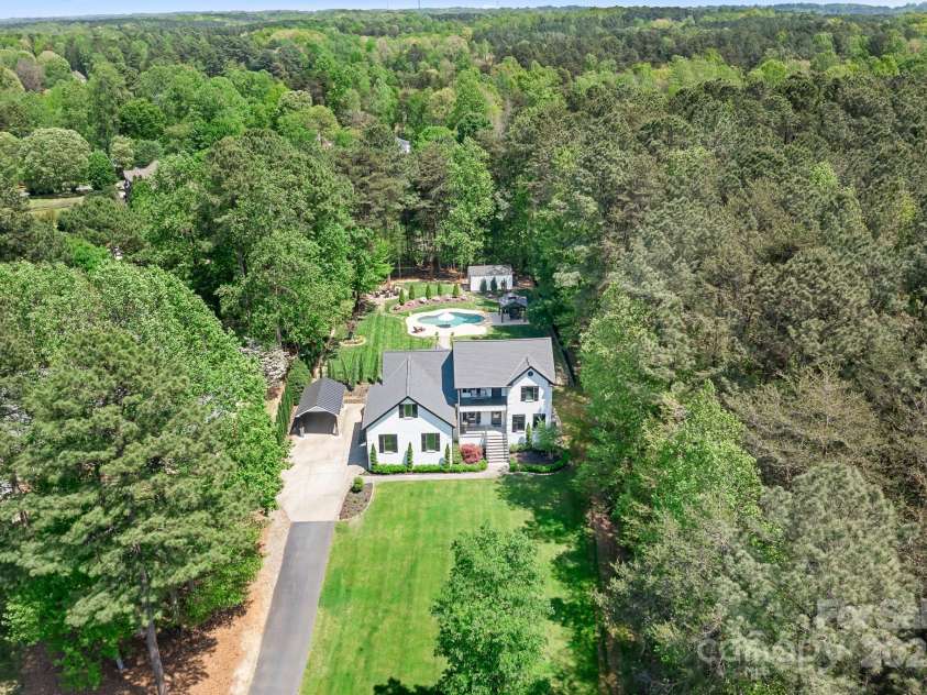 317 Marietta Road, Mooresville, NC 28117.  MLS# CAR4253368, YatesRealty ID 18093. Nestled and private, this beautiful home with Deeded Boat Slip and Lake View is ready for you!