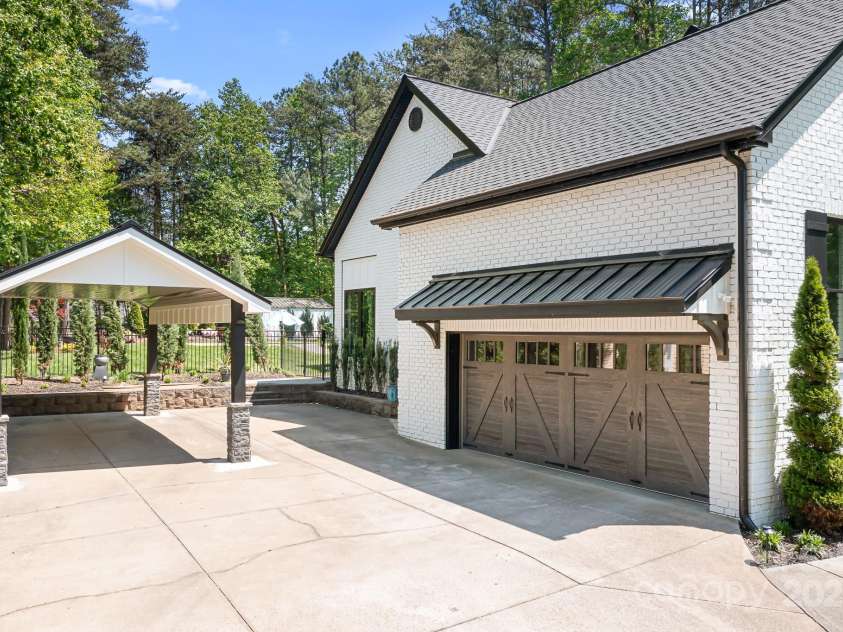 317 Marietta Road, Mooresville, NC 28117.  MLS# CAR4253368, YatesRealty ID 18093. New Garage Door and Tin overhang.