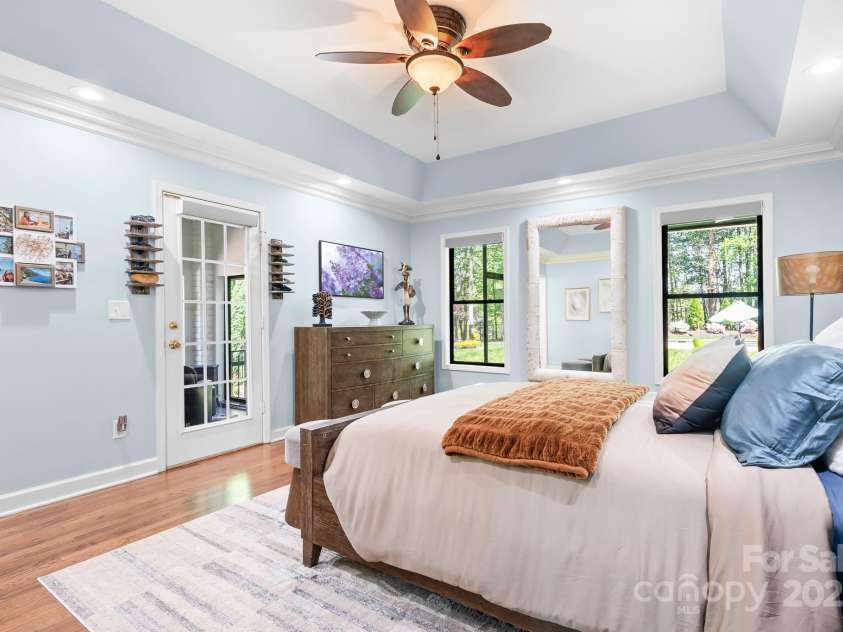 317 Marietta Road, Mooresville, NC 28117.  MLS# CAR4253368, YatesRealty ID 18093. Primary Bedroom on main floor with Trey ceiling.  Door opens to private 4 season room with sliding glass doors.