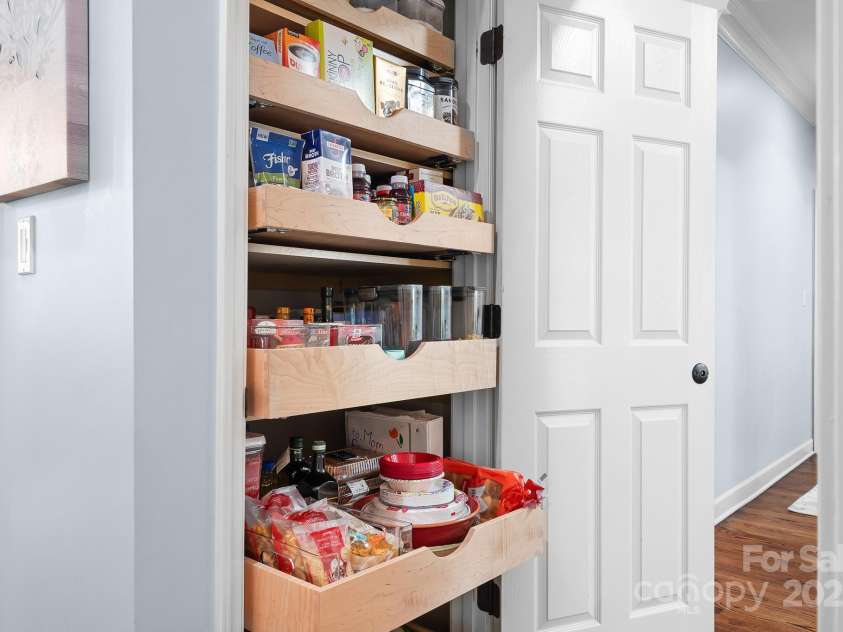 317 Marietta Road, Mooresville, NC 28117.  MLS# CAR4253368, YatesRealty ID 18093. Pull out shelving maximizes the Pantry.