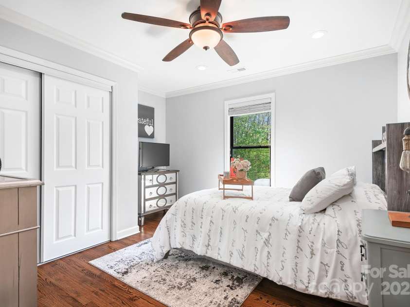 317 Marietta Road, Mooresville, NC 28117.  MLS# CAR4253368, YatesRealty ID 18093. Secondary Bedroom with custom closet design and alcove for furniture adding extra space.