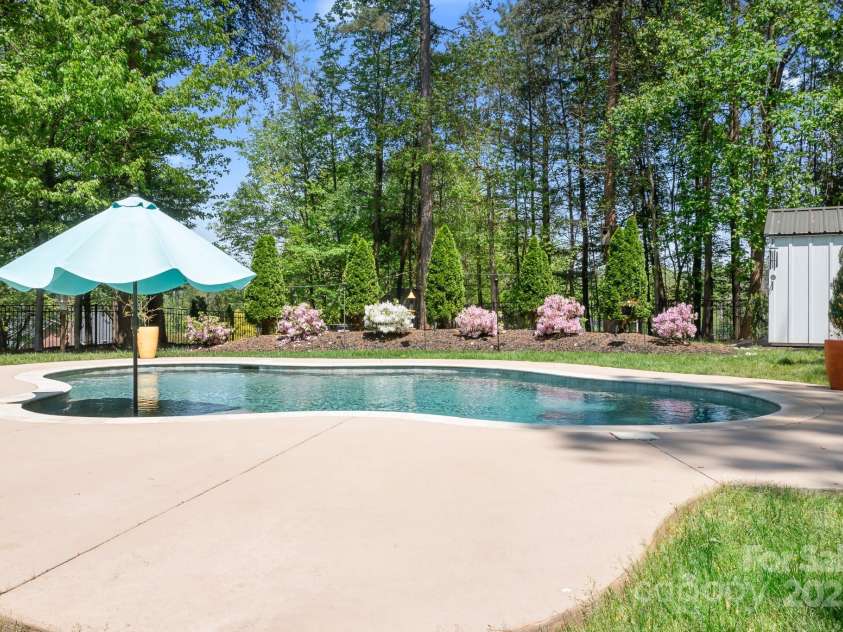 317 Marietta Road, Mooresville, NC 28117.  MLS# CAR4253368, YatesRealty ID 18093. Umbrella is over an in water tanning shelf