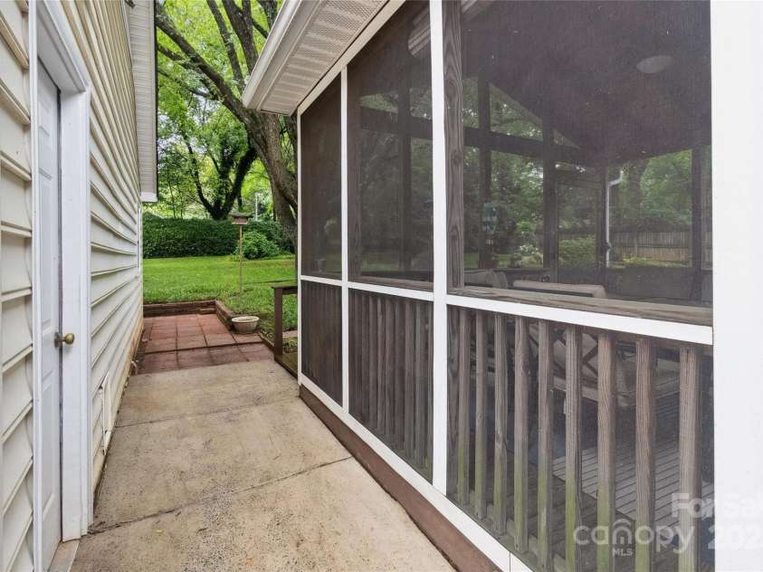 1821 Bonnie Lane, Charlotte, NC 28213.  MLS# CAR4264197, YatesRealty ID 18100. Screened in porch close to detached garage