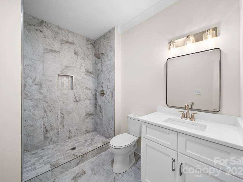 4460 R L Lane, Midland, NC 28107.  MLS# CAR4302078, YatesRealty ID 18103. Downstairs Bathroom
