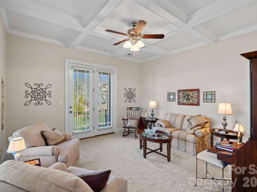 8056 Windsong Road, Denver, NC 28037.  MLS# CAR4338540, YatesRealty ID 18104. Den with coferred ceiling - great space for conversations, reading, an office, or your own vision.