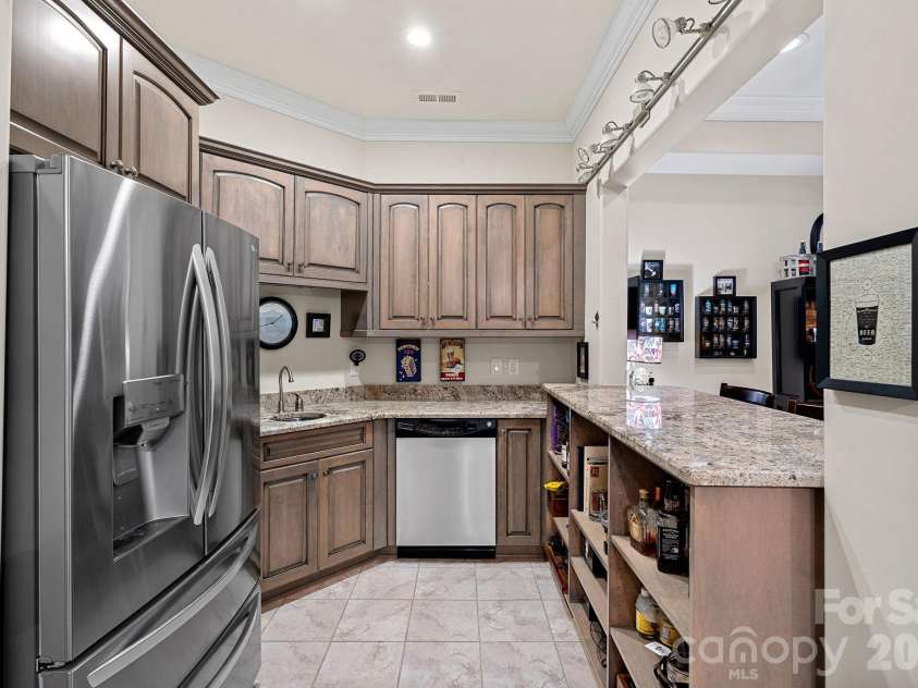 8056 Windsong Road, Denver, NC 28037.  MLS# CAR4338540, YatesRealty ID 18104. Kitchenette/wet bar with counter seating.