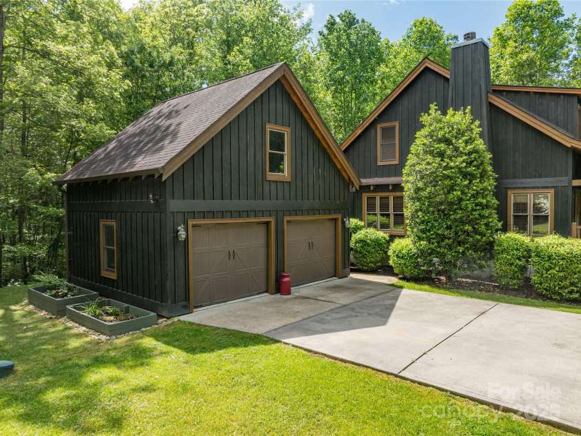 86 Sweet Birch Drive, Maggie Valley, NC 28751.  MLS# CAR4261566, YatesRealty ID 18106. 2-car garage with upper workkshop