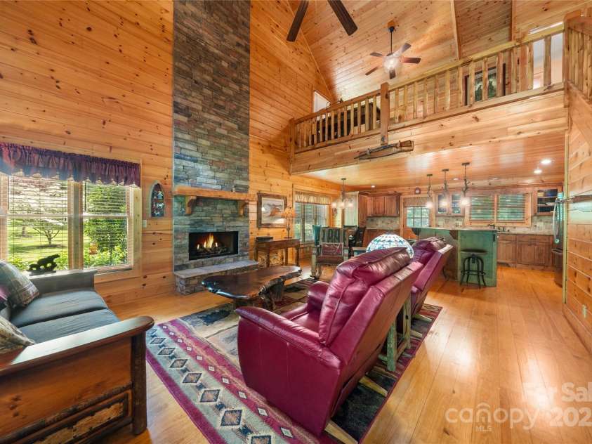86 Sweet Birch Drive, Maggie Valley, NC 28751.  MLS# CAR4261566, YatesRealty ID 18106. 2-story fireplace in greatroom