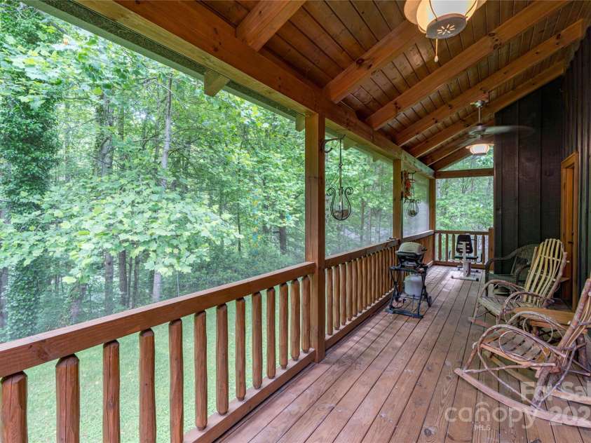 86 Sweet Birch Drive, Maggie Valley, NC 28751.  MLS# CAR4261566, YatesRealty ID 18106. Creek Sound from screened porch off the Kitchen and bedroom