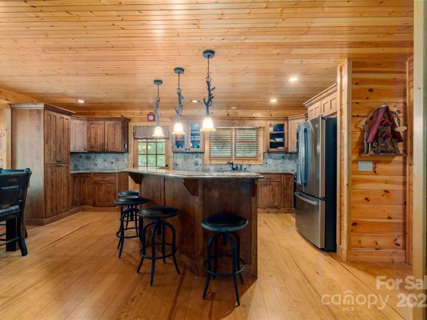 86 Sweet Birch Drive, Maggie Valley, NC 28751.  MLS# CAR4261566, YatesRealty ID 18106. Granite topped island in kitchen