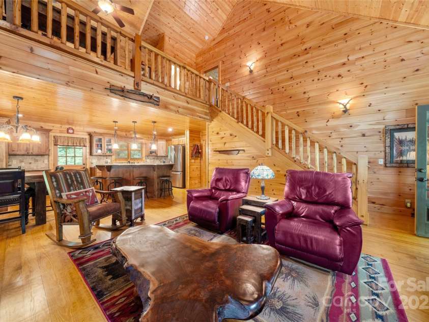 86 Sweet Birch Drive, Maggie Valley, NC 28751.  MLS# CAR4261566, YatesRealty ID 18106. Loft above - beautiful wood stairs...