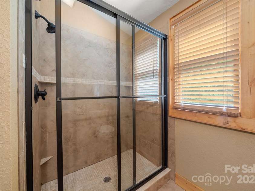 86 Sweet Birch Drive, Maggie Valley, NC 28751.  MLS# CAR4261566, YatesRealty ID 18106. Shower in upper bath