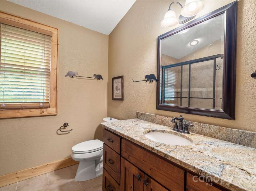 86 Sweet Birch Drive, Maggie Valley, NC 28751.  MLS# CAR4261566, YatesRealty ID 18106. Upper bath - granite counters