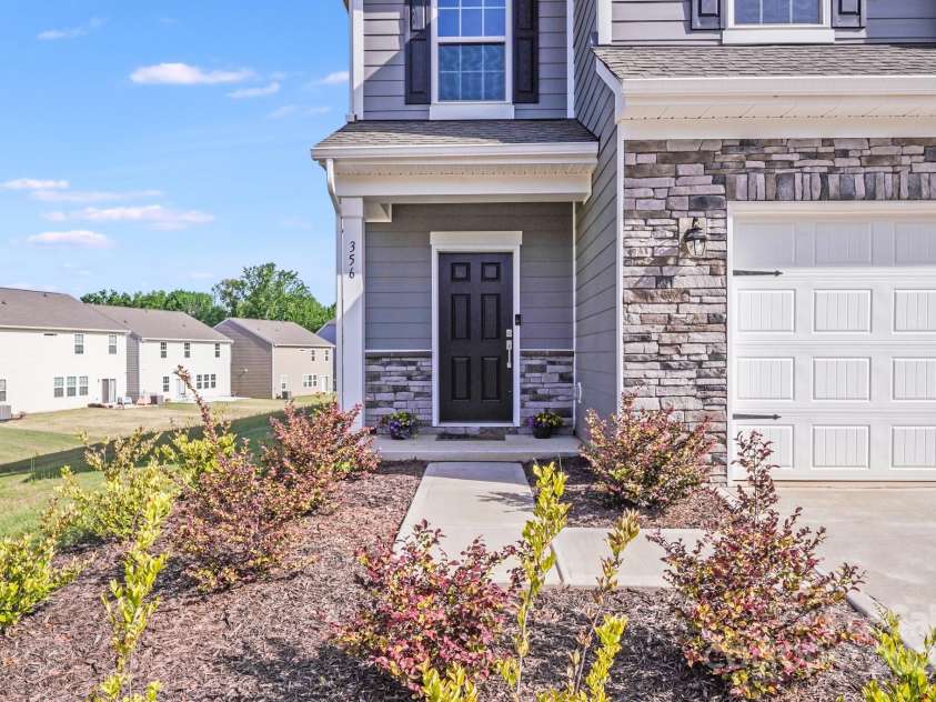 356 Runner Stone Lane, Fort Mill, SC 29715.  MLS# CAR4253320, YatesRealty ID 18108. Beautiful stone accents 