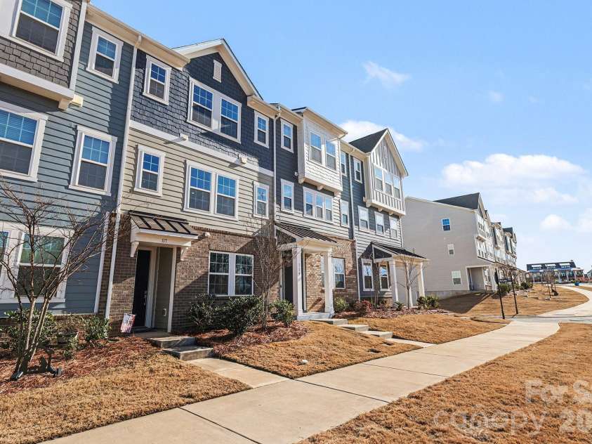 117 Morning Gap Parkway, Fort Mill, SC 29715.  MLS# CAR4333429, YatesRealty ID 1812. Front of townhome with sidewalks.