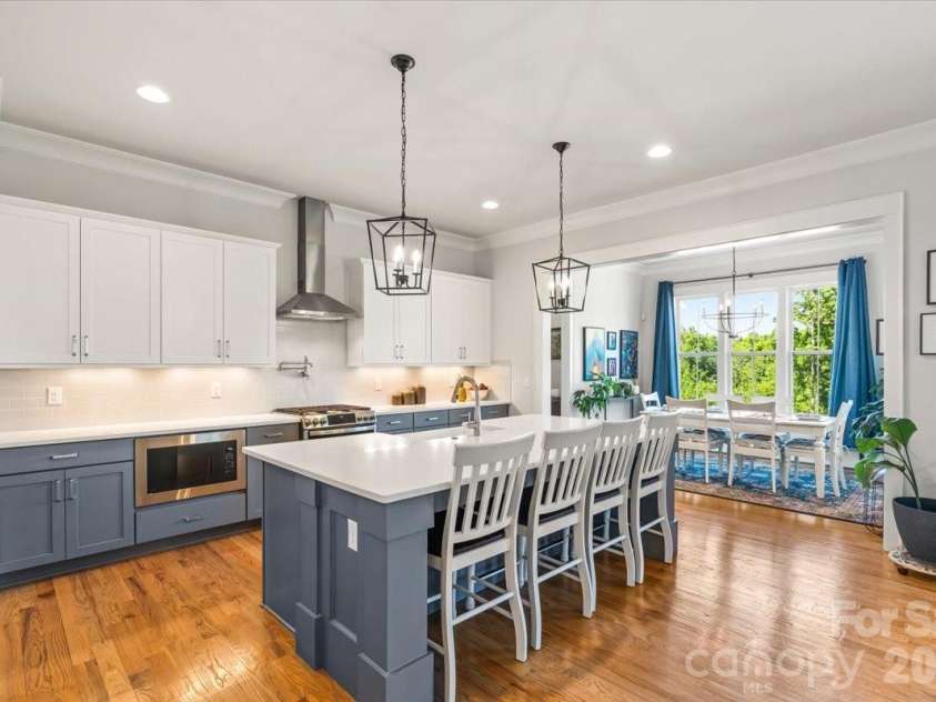 559 Preservation Drive, Fort Mill, SC 29715.  MLS# CAR4369169, YatesRealty ID 18120. Chef's kitchen anchored by an oversized island... built for gathering as much as cooking