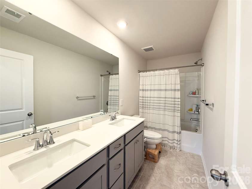 6570 Gopher Road, Lancaster, SC 29720.  MLS# CAR4343153, YatesRealty ID 18124. Secondary bathroom upstairs with double vanity.