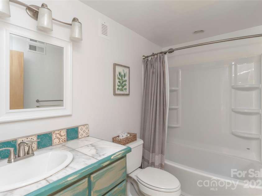 7 Grove Street, Weaverville, NC 28787.  MLS# CAR4262820, YatesRealty ID 18128. Basement Full Bathroom