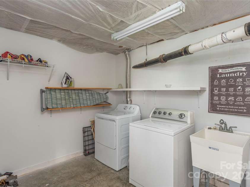 7 Grove Street, Weaverville, NC 28787.  MLS# CAR4262820, YatesRealty ID 18128. Big Laundry Room in Basement