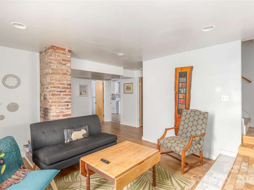 7 Grove Street, Weaverville, NC 28787.  MLS# CAR4262820, YatesRealty ID 18128. Cozy 2nd Living Space in basement
