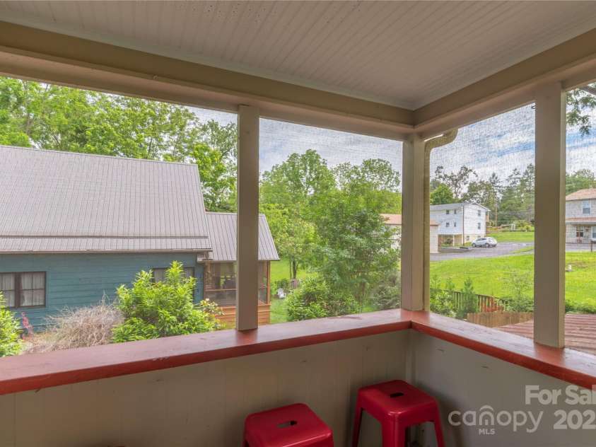 7 Grove Street, Weaverville, NC 28787.  MLS# CAR4262820, YatesRealty ID 18128. Cozy outdoor sitting area from main level Kitchen