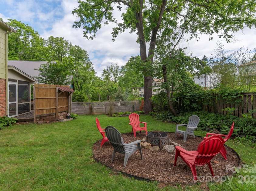 7 Grove Street, Weaverville, NC 28787.  MLS# CAR4262820, YatesRealty ID 18128. Fully Fenced in side yard with firepit