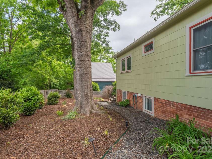 7 Grove Street, Weaverville, NC 28787.  MLS# CAR4262820, YatesRealty ID 18128. Left side of home walkway