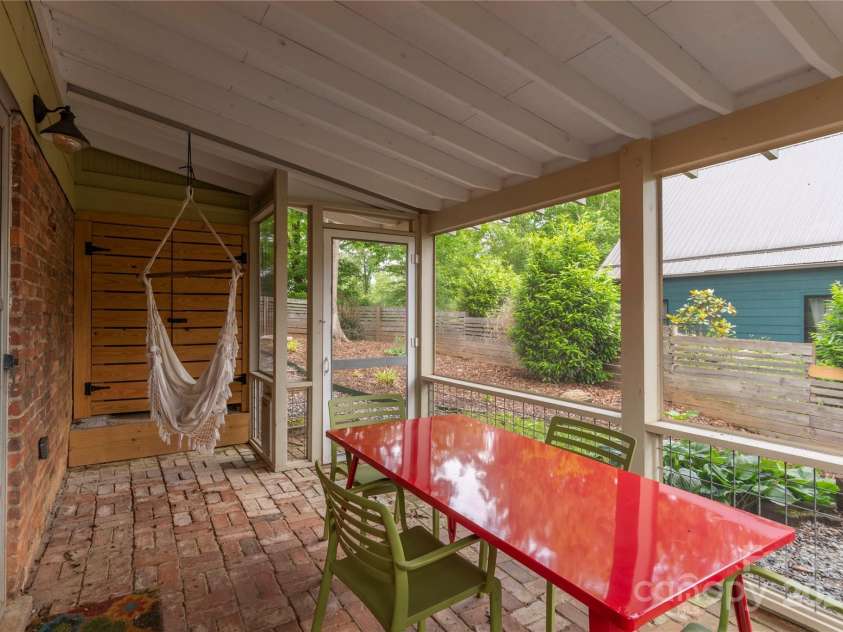 7 Grove Street, Weaverville, NC 28787.  MLS# CAR4262820, YatesRealty ID 18128. Screened in brick patio