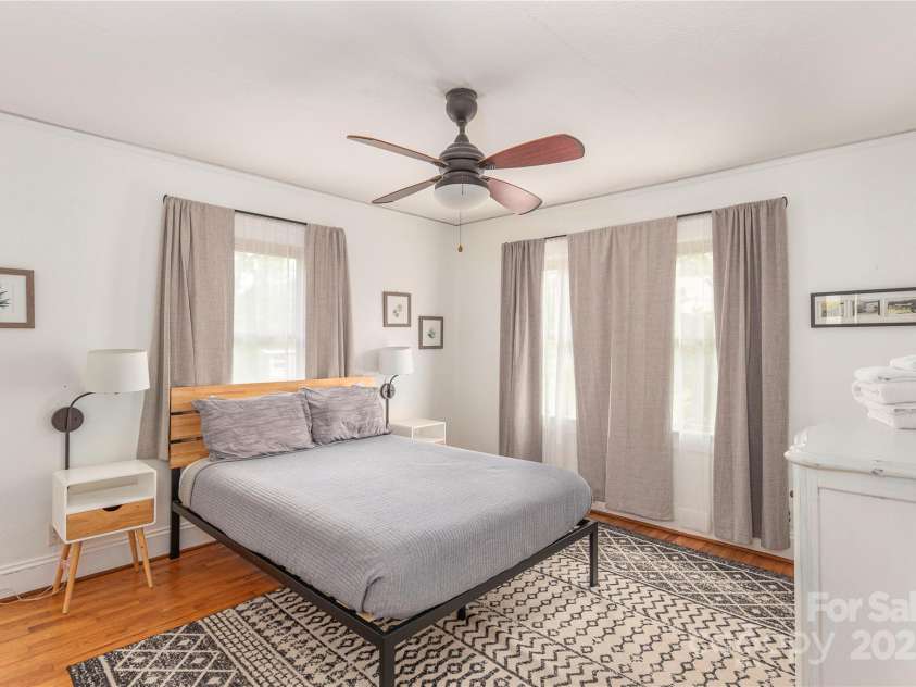 7 Grove Street, Weaverville, NC 28787.  MLS# CAR4262820, YatesRealty ID 18128. Spacious and bright Primary Bedroom