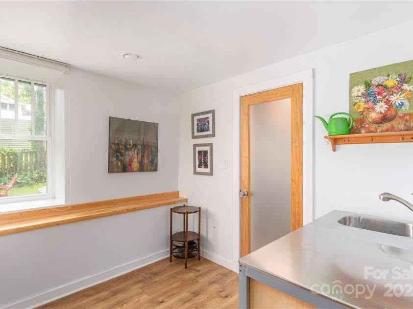 7 Grove Street, Weaverville, NC 28787.  MLS# CAR4262820, YatesRealty ID 18128. Wet Bar area in basement with big closet for storage