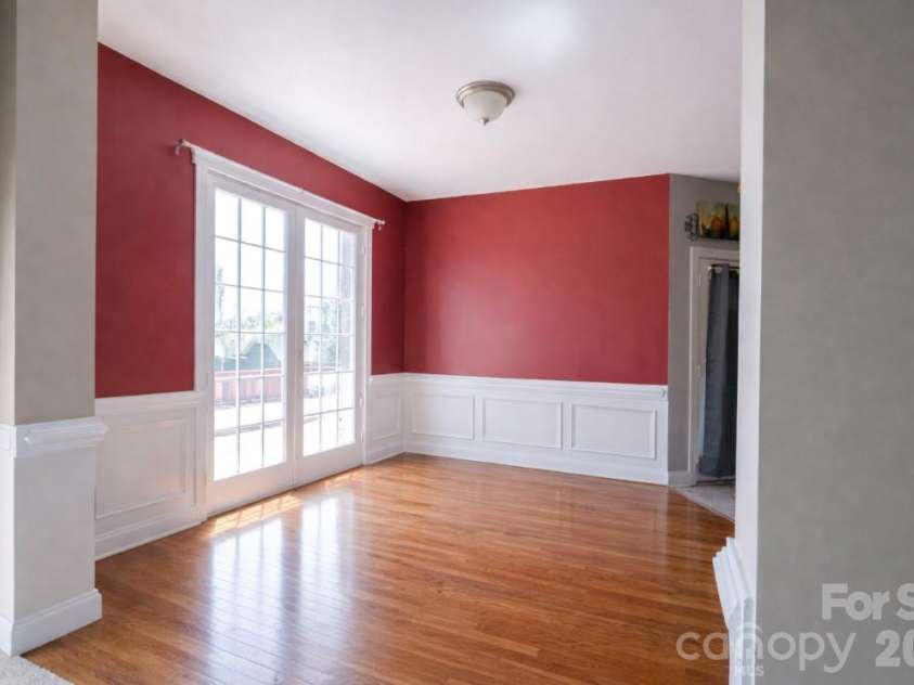 7008 Brett Drive, Monroe, NC 28110.  MLS# CAR4368447, YatesRealty ID 18129. Dining room with hardwood floors