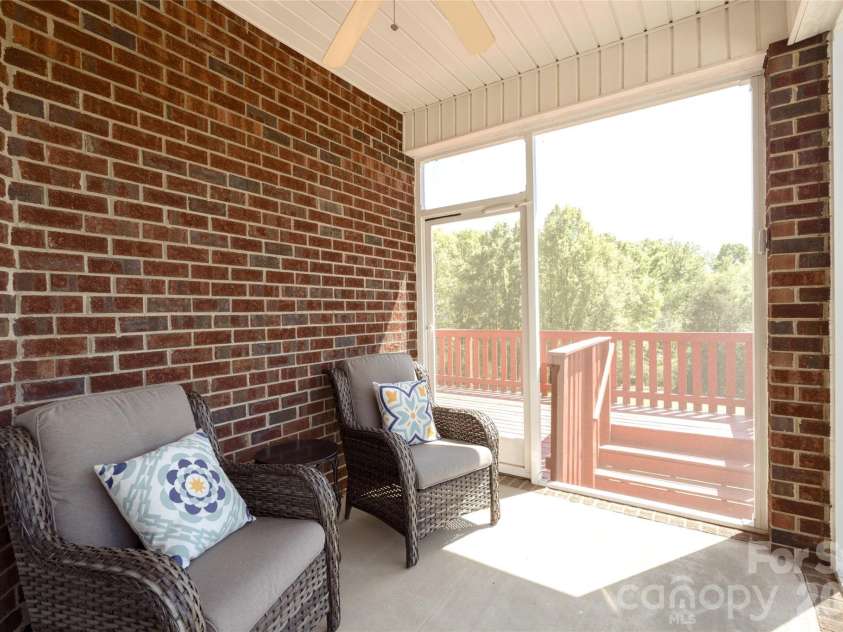 7008 Brett Drive, Monroe, NC 28110.  MLS# CAR4368447, YatesRealty ID 18129. Enclosed side porch