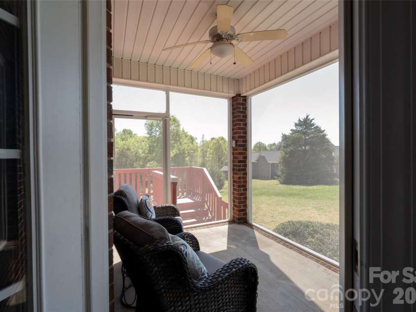 7008 Brett Drive, Monroe, NC 28110.  MLS# CAR4368447, YatesRealty ID 18129. Enclosed side porch