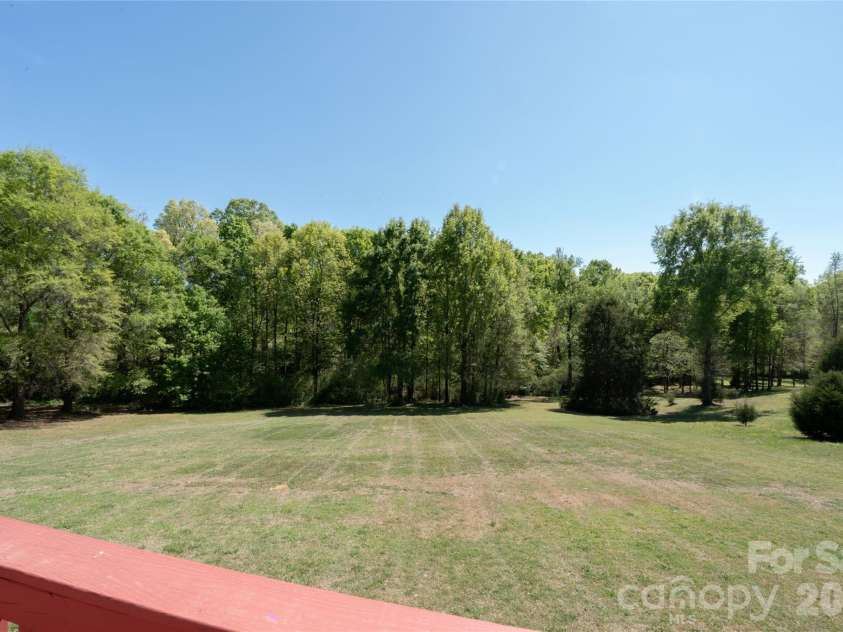 7008 Brett Drive, Monroe, NC 28110.  MLS# CAR4368447, YatesRealty ID 18129. Expansive back yard