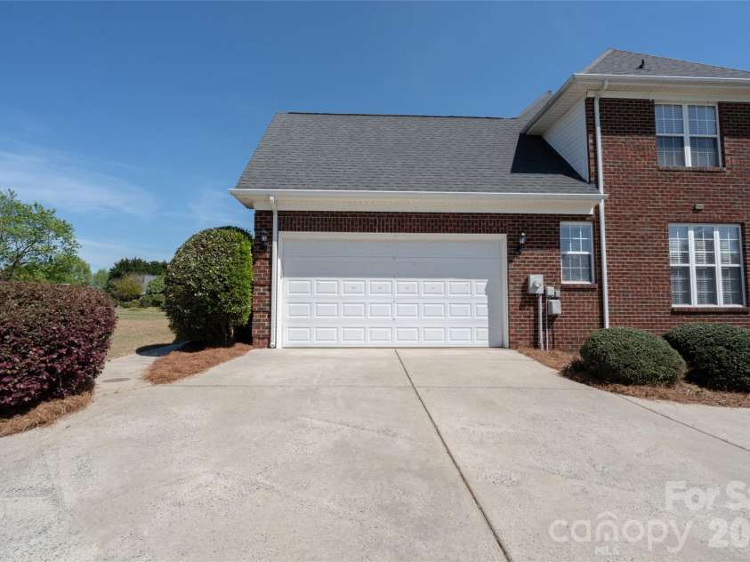 7008 Brett Drive, Monroe, NC 28110.  MLS# CAR4368447, YatesRealty ID 18129. Side load garage