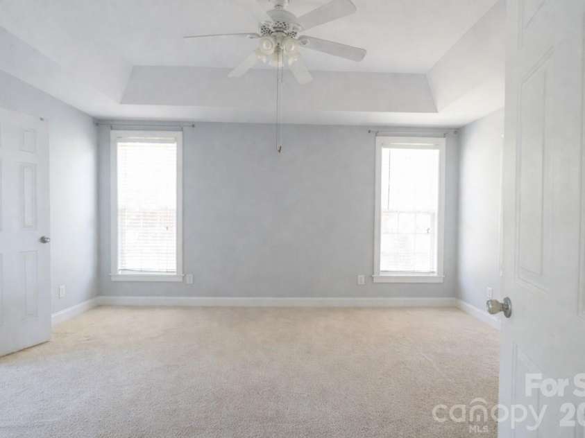 7008 Brett Drive, Monroe, NC 28110.  MLS# CAR4368447, YatesRealty ID 18129. Spacious primary bedroom