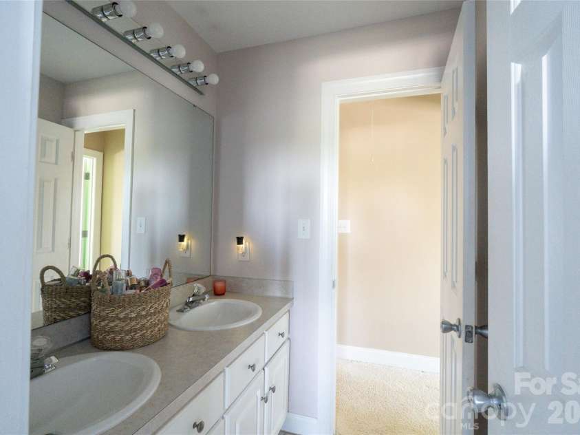 7008 Brett Drive, Monroe, NC 28110.  MLS# CAR4368447, YatesRealty ID 18129. Upstairs bathroom