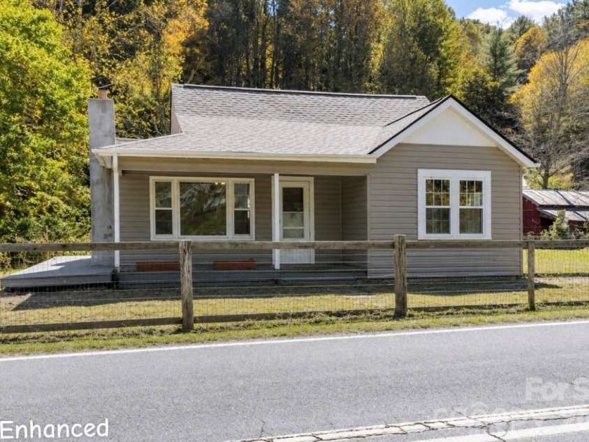689 Bald Mountain Road, Burnsville, NC 28714.  MLS# CAR4309436, YatesRealty ID 18134. Charming 1950's waterfront retreat