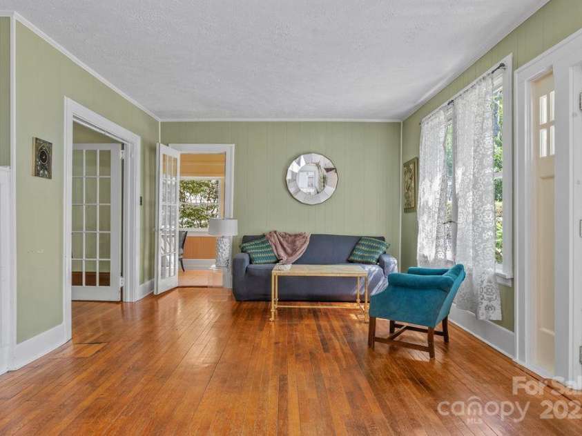 54 Holland Street, Asheville, NC 28801.  MLS# CAR4249422, YatesRealty ID 18138. Enter into the living area