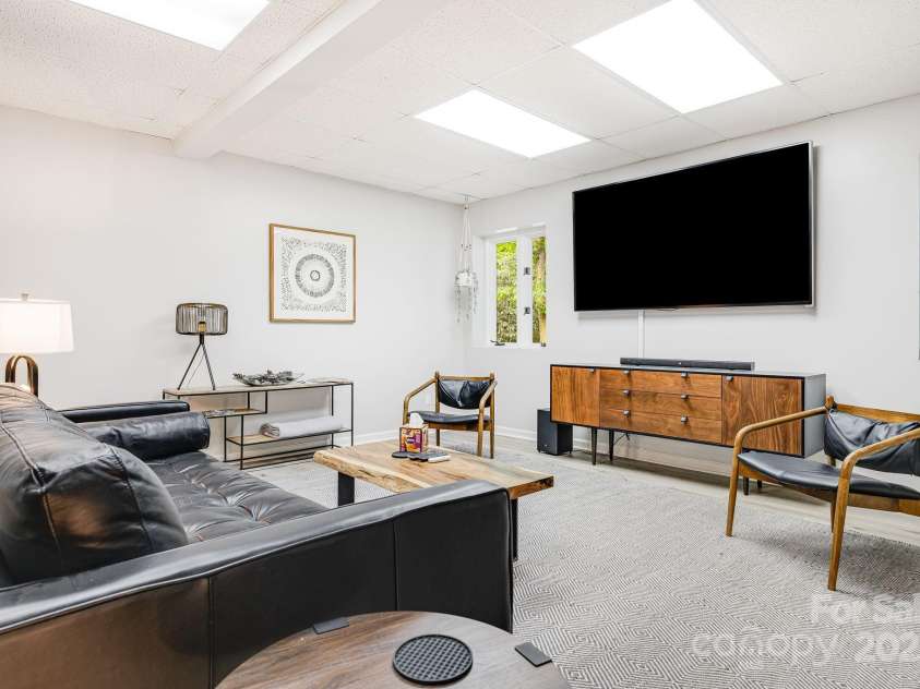 1245 Old Fort Road, Fairview, NC 28730.  MLS# CAR4258994, YatesRealty ID 18139. Basement Livingroom