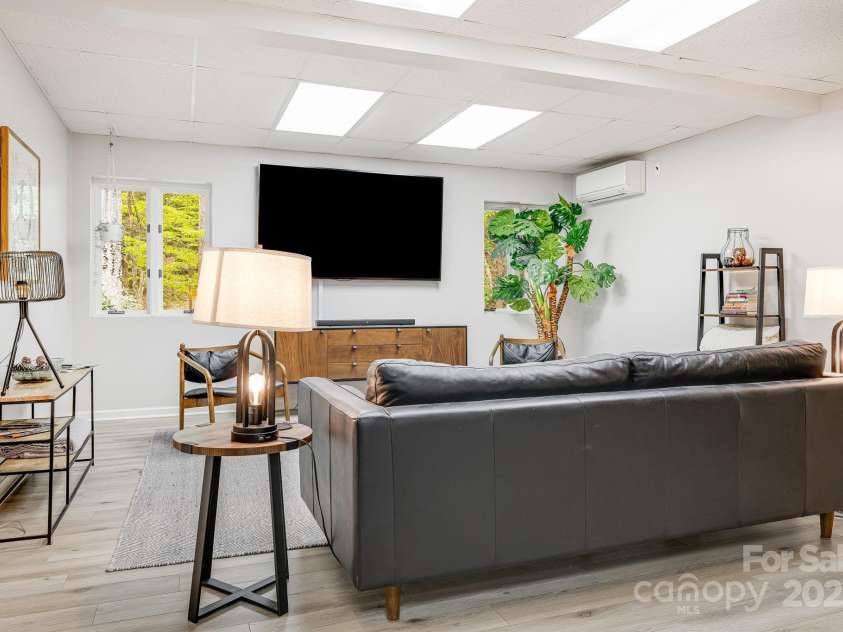 1245 Old Fort Road, Fairview, NC 28730.  MLS# CAR4258994, YatesRealty ID 18139. Basement Livingroom