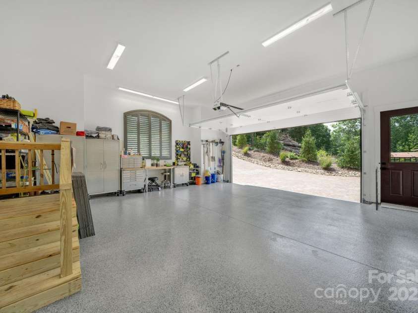 36 Northland Court, Flat Rock, NC 28731.  MLS# CAR4293031, YatesRealty ID 1814. 2 car garage w/ epoxy floors & fenced dog run entrance 